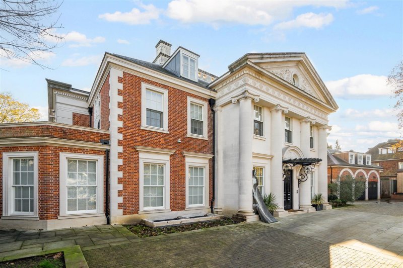 Exterior image of rare house for sale in Kenwood N6 on Compton Avenue, freehold site of 0.82 acres, overlooking Highgate Golf Course
